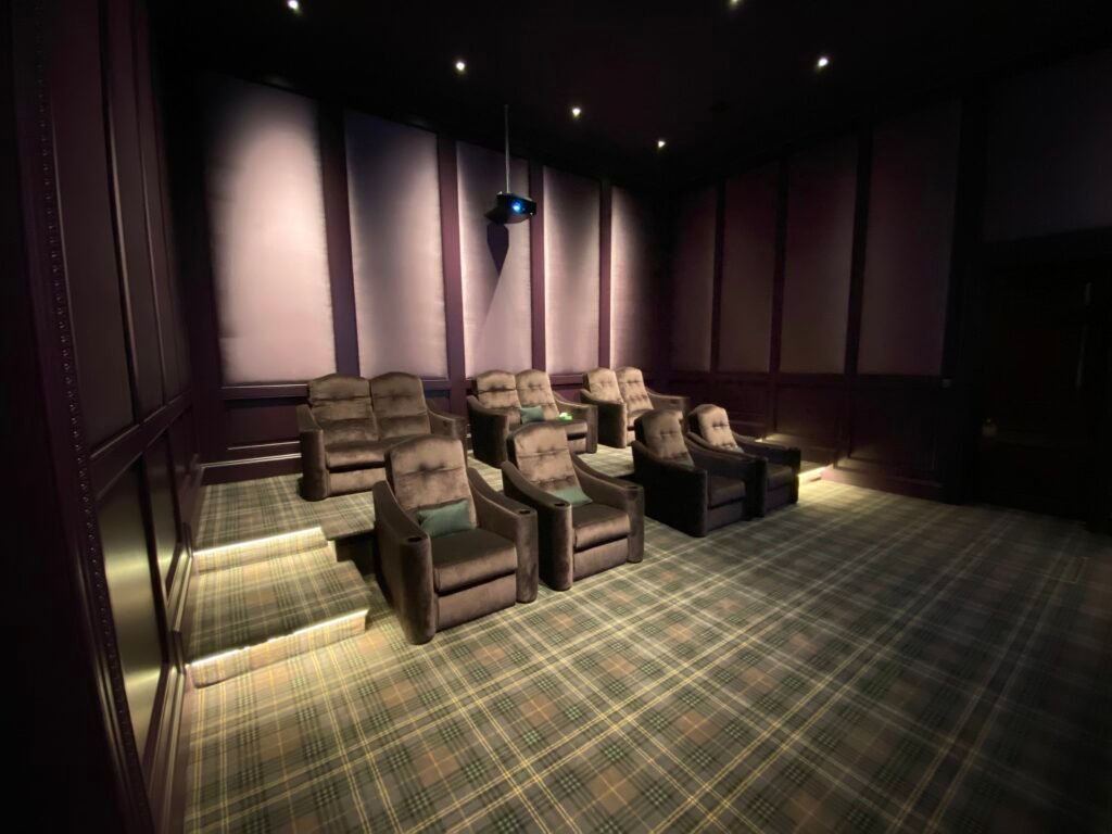 Building a dedicated cinema. The finished room, looking at the custom chairs.